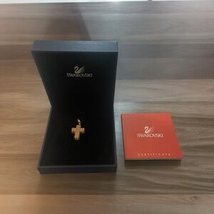 New in Box Signed Swarovski gold plated cross charm.